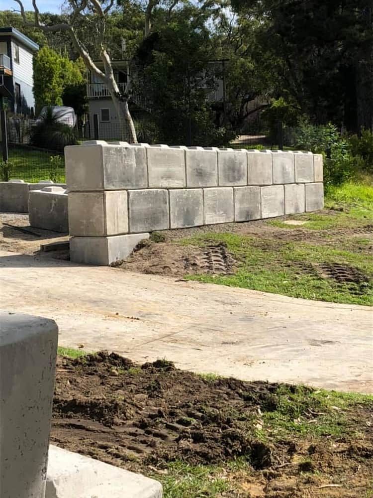 A Concrete Wall is Being Built in a Grassy Field — BeCivil in Vicentia, NSW