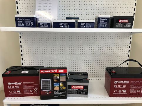 A Shelf With A Variety Of Batteries On It — Coast 2 Coast Batteries in Central Coast, NSW