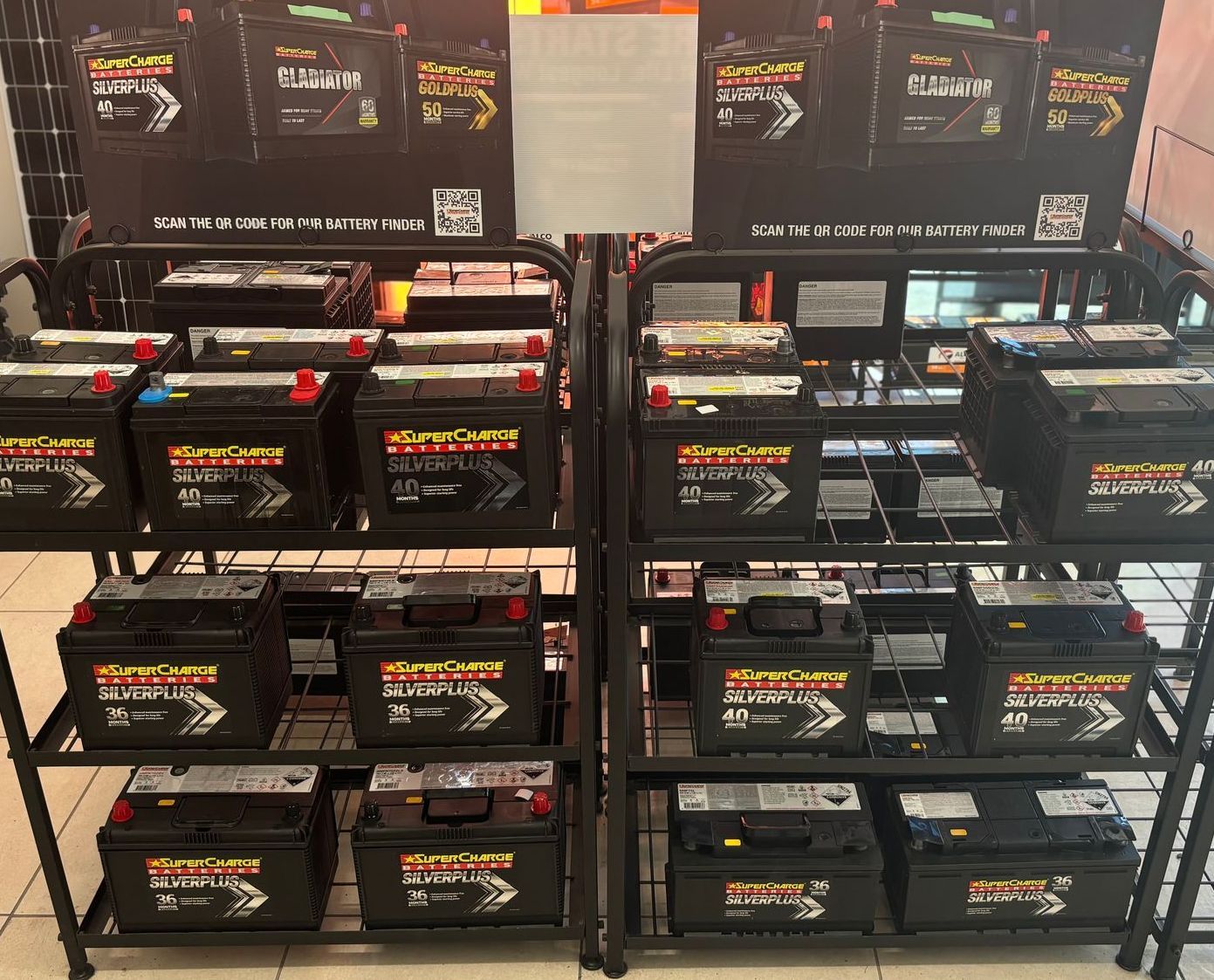 A Shelf Full Of Batteries Including A 12v Portable Power Station — Coast 2 Coast Batteries in West Gosford, NSW