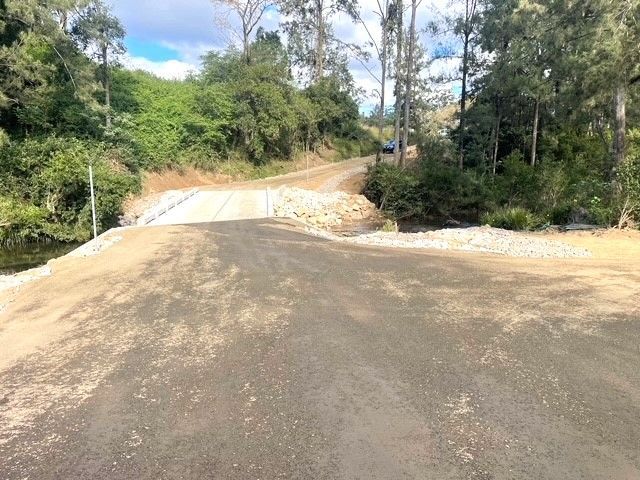 A dirt road going through a forest with trees on both sides — Blue Dog Landscape Supplies In Newee Creek, NSW