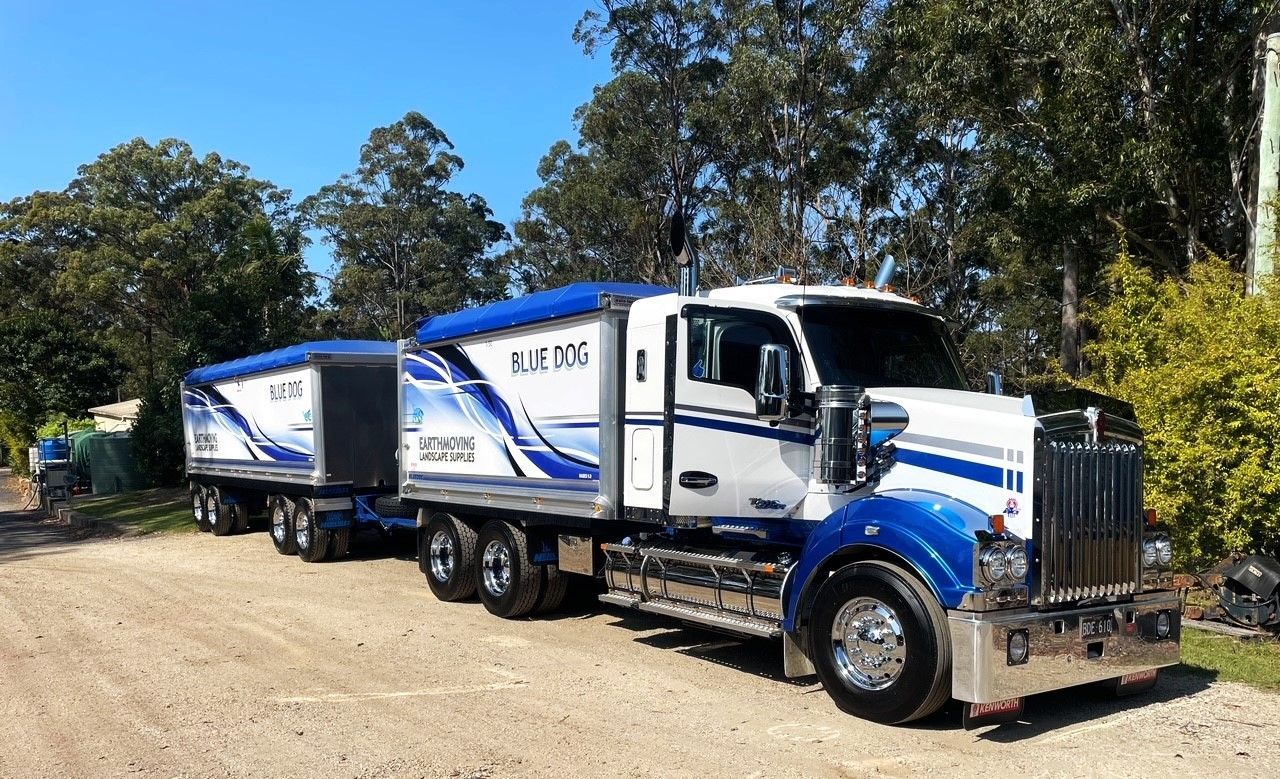 A blue and white semi truck is parked on a dirt road — Blue Dog Landscape Supplies In Newee Creek, NSW