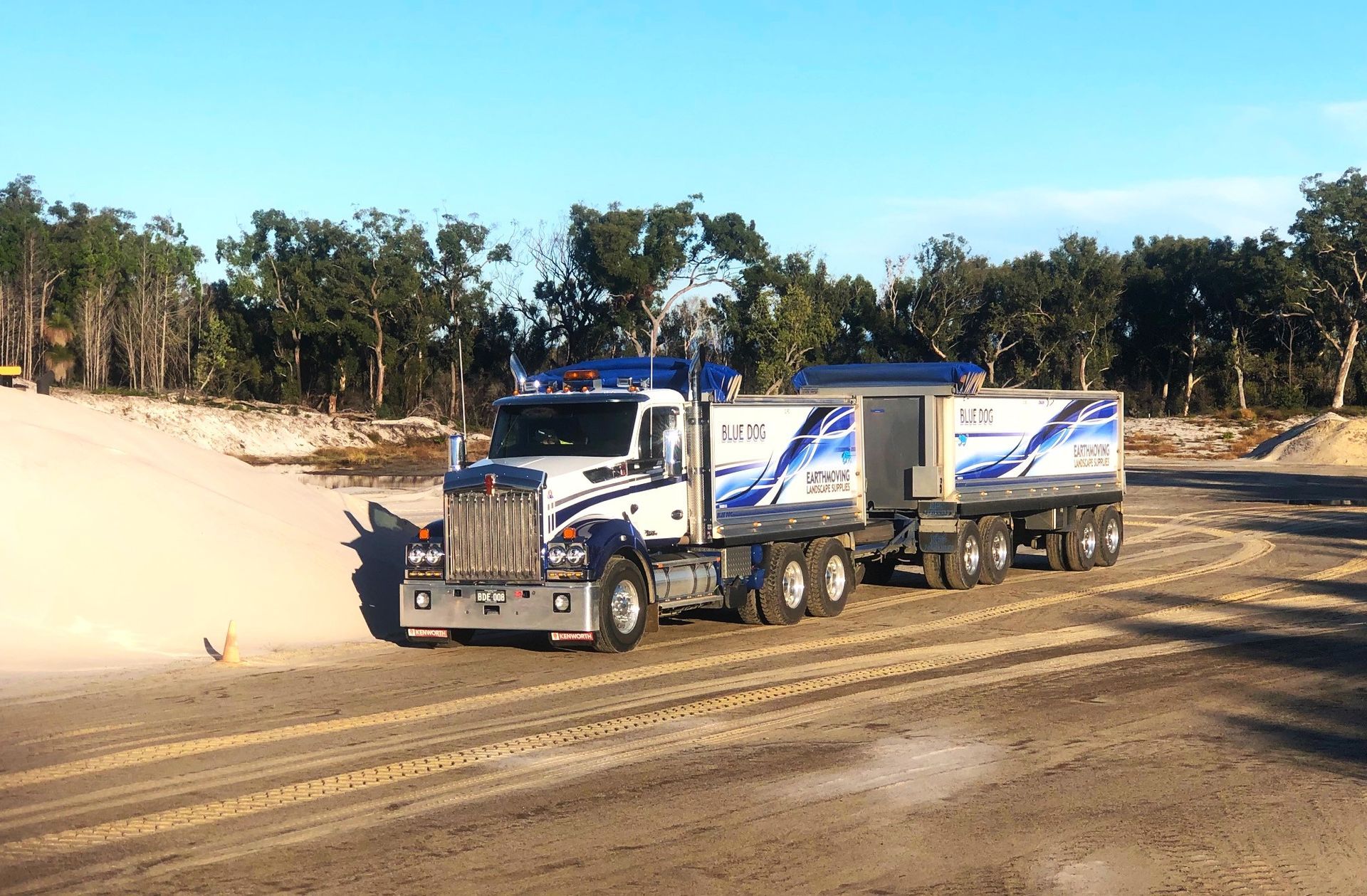 A semi truck is driving down a dirt road — Blue Dog Landscape Supplies In Newee Creek, NSW