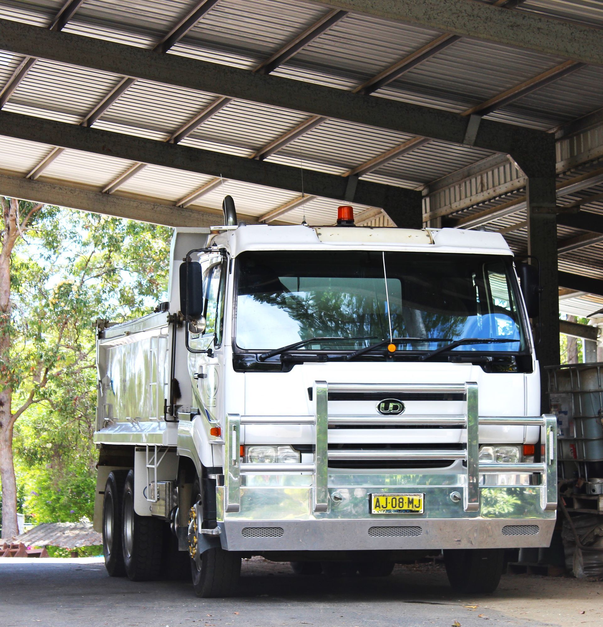 A white truck parked underneath a shed — Blue Dog Landscape Supplies In Newee Creek, NSW