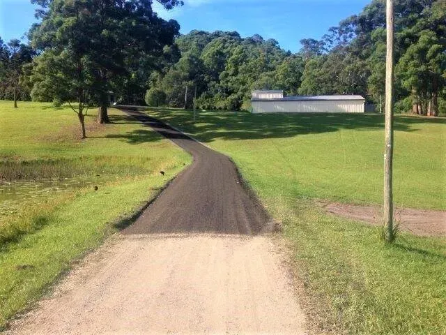 A Dirt Road Going Through A Grassy Field — Blue Dog Landscape Supplies In Newee Creek, NSW