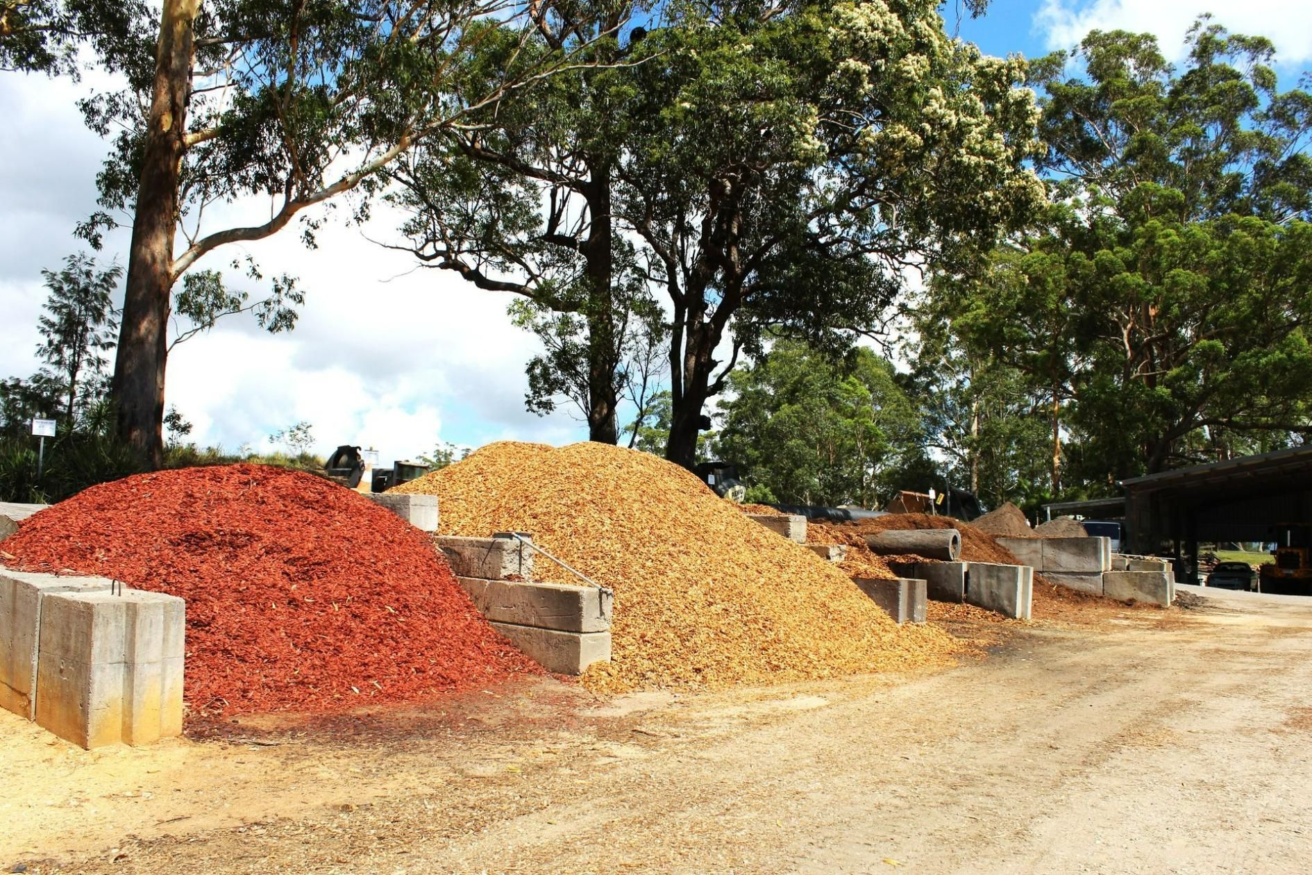 A pile of mulch is sitting on top of a pile of gravel — Blue Dog Landscape Supplies In Newee Creek, NSW