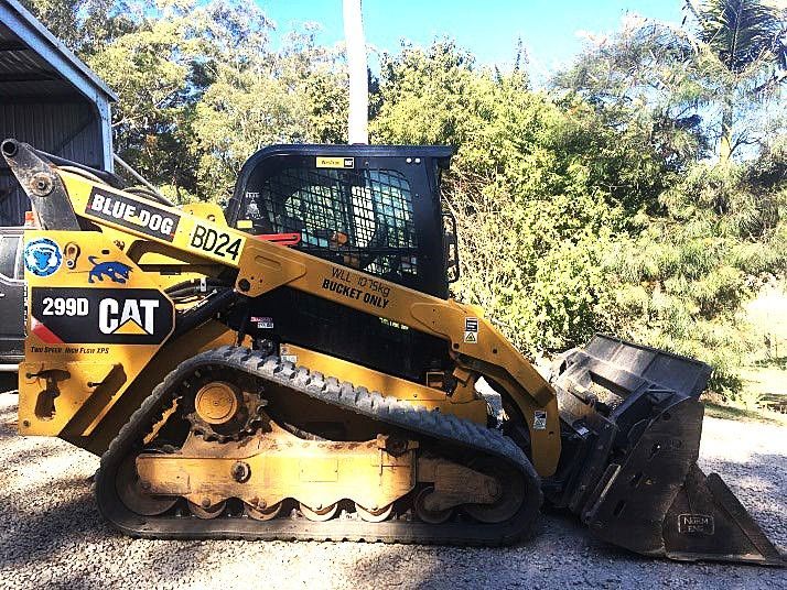 A yellow cat bulldozer is parked in a gravel lot — Blue Dog Landscape Supplies In Newee Creek, NSW