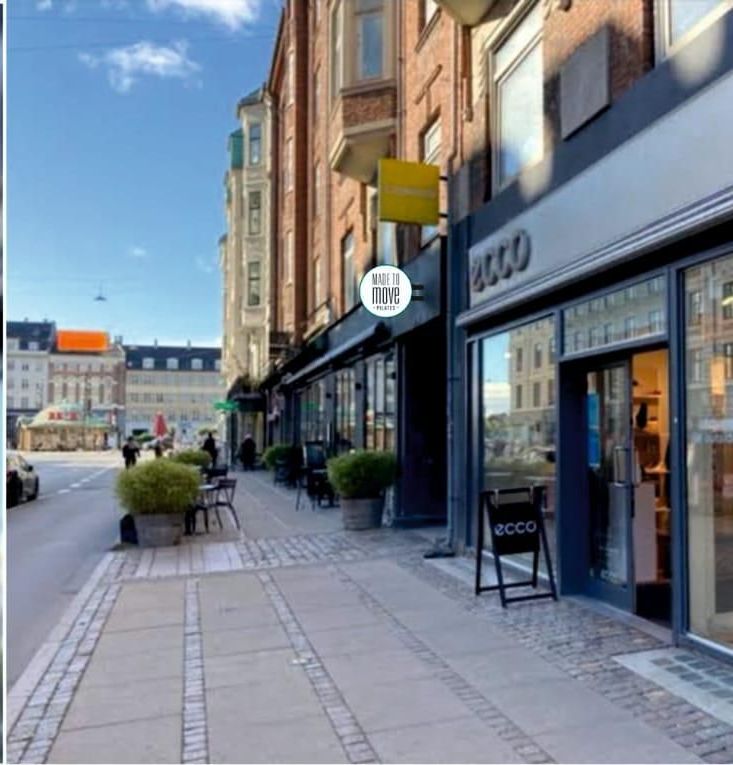 A sign on the side of a building that says made to move