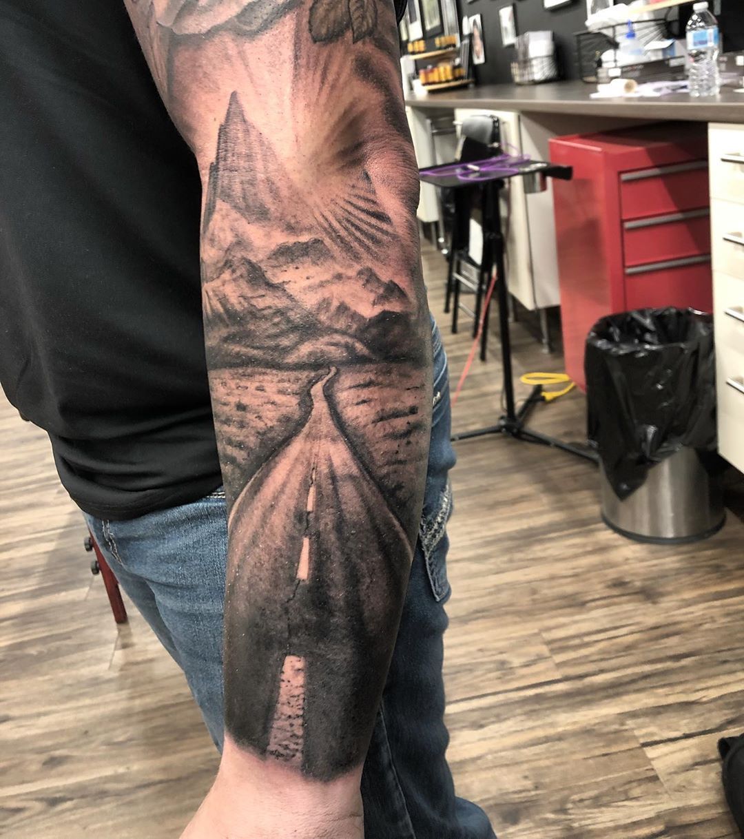Mountain and Highway Tattoo by Steve Hayes at Black Gold Tattoo Co in Edmonton Alberta Canada