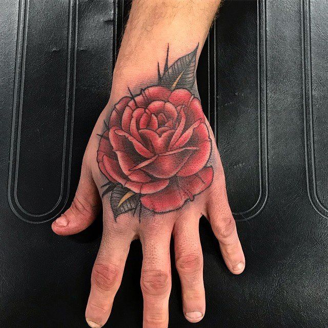 Rose Hand Tattoo by Amber Strange at Black Gold Tattoo Co in Edmonton Alberta Canada