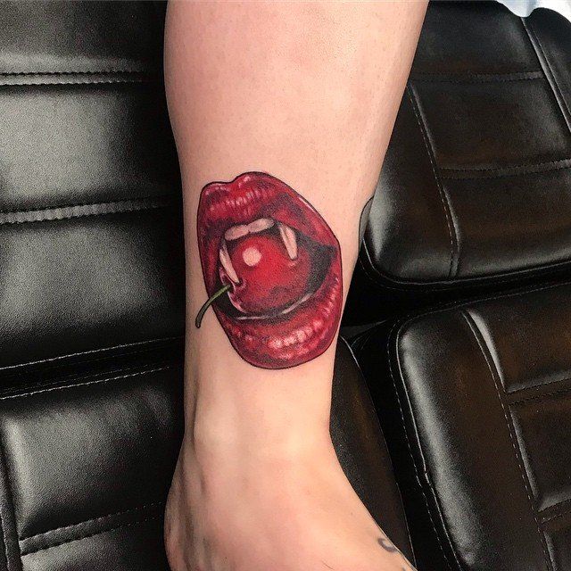 Cherry Vampire Lips Tattoo by Amber Strange at Black Gold Tattoo Co in Edmonton Alberta Canada