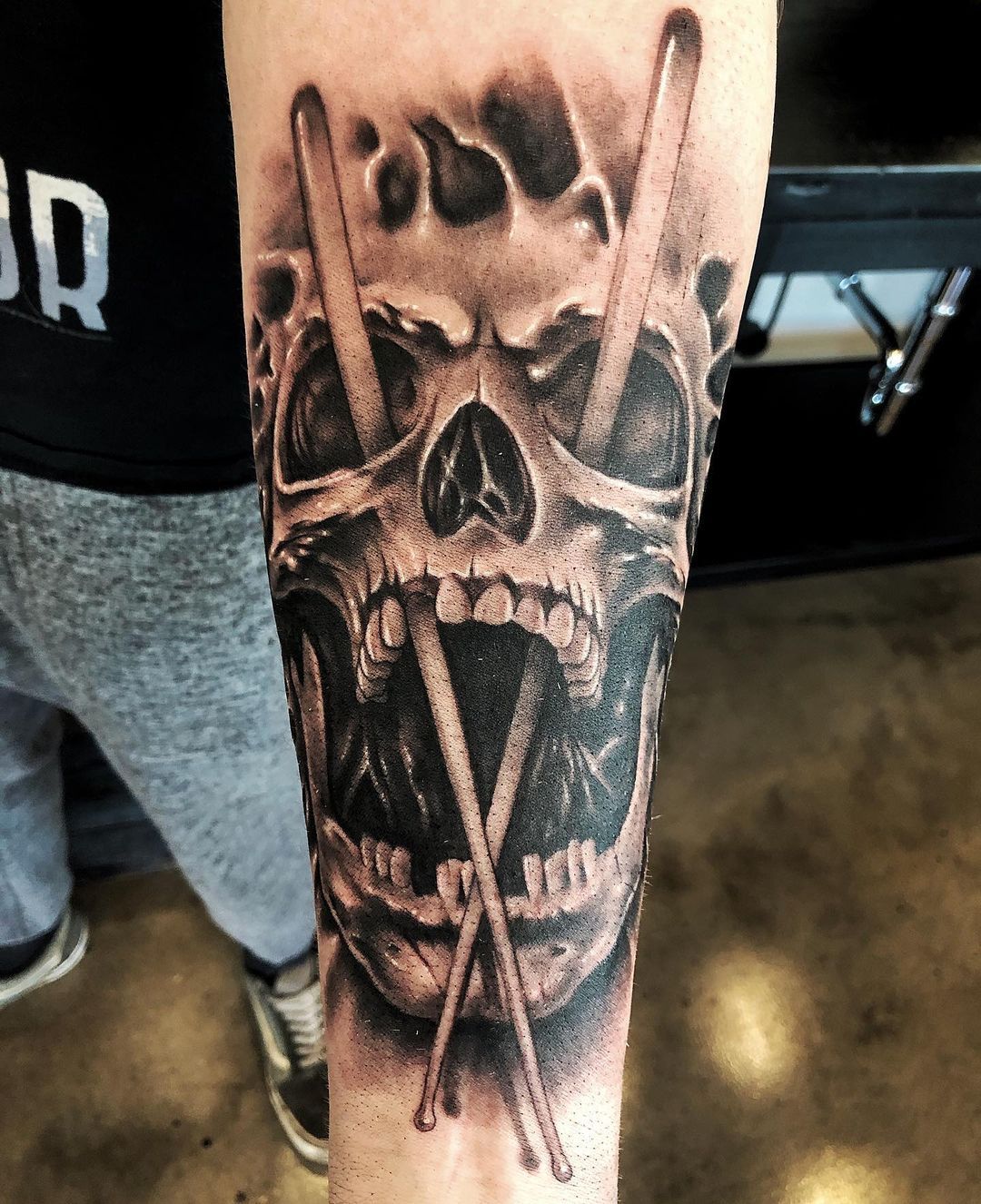 Skull and Drumsticks Tattoo by Chad Lavers at Crimson Empire Tattoo in Edmonton Alberta Canada