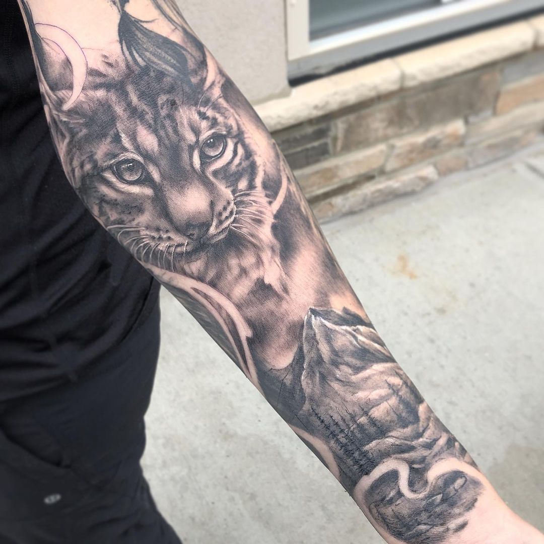 Lynx and Mountain Scenery Tattoo by Sarah Michelle at Black Gold Tattoo Co in Edmonton Alberta Canada