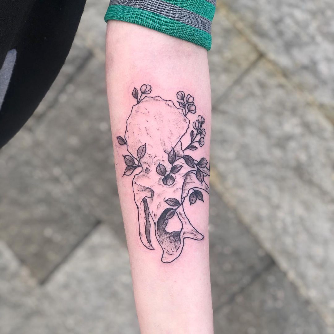 Dinosaur Skull Tattoo by Vanessa Spezowka at Crimson Empire Tattoo in Edmonton Alberta Canada