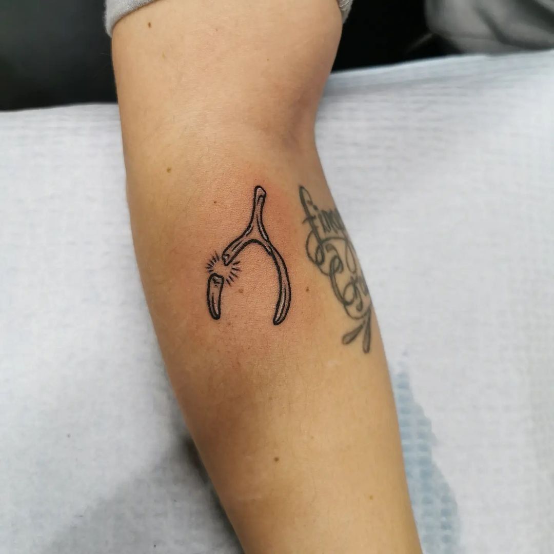 Wishbone Tattoo by Wen at Crimson Empire Tattoo in Edmonton Alberta Canada