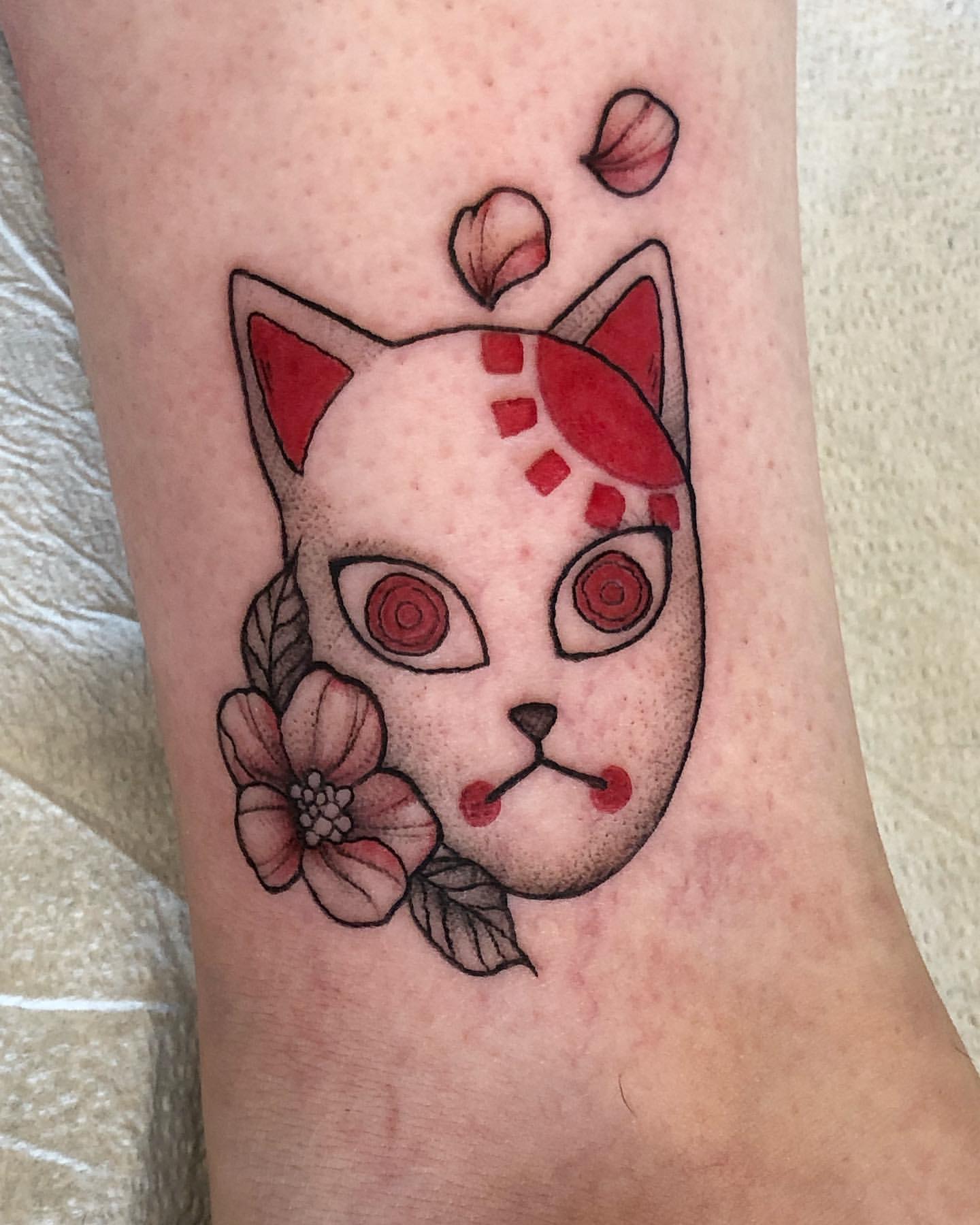 Tanjiro's Mask (Demon Slayer) Tattoo by Vanessa Spezowka at Crimson Empire Tattoo in Edmonton Alberta Canada