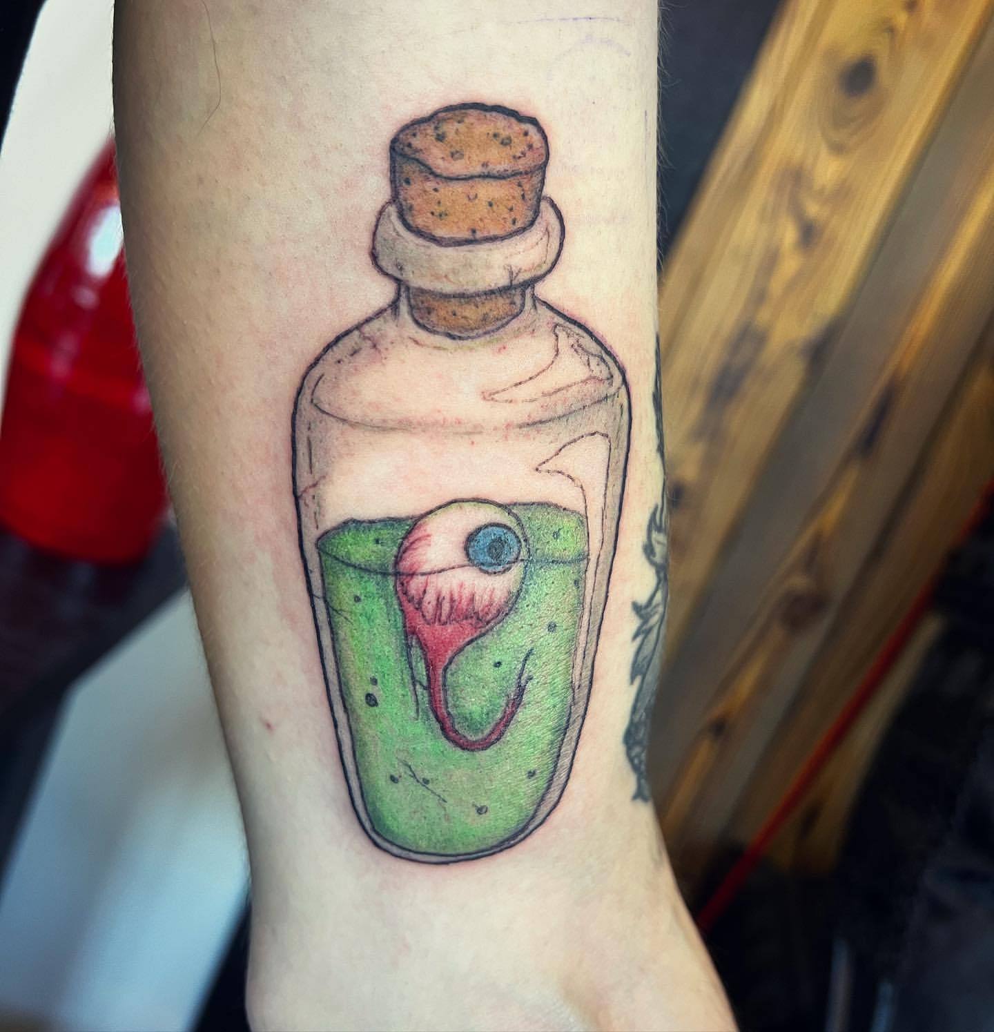 Eyeball Potion Tattoo by Vinny Nguyen at Crimson Empire Tattoo in Edmonton Alberta Canada