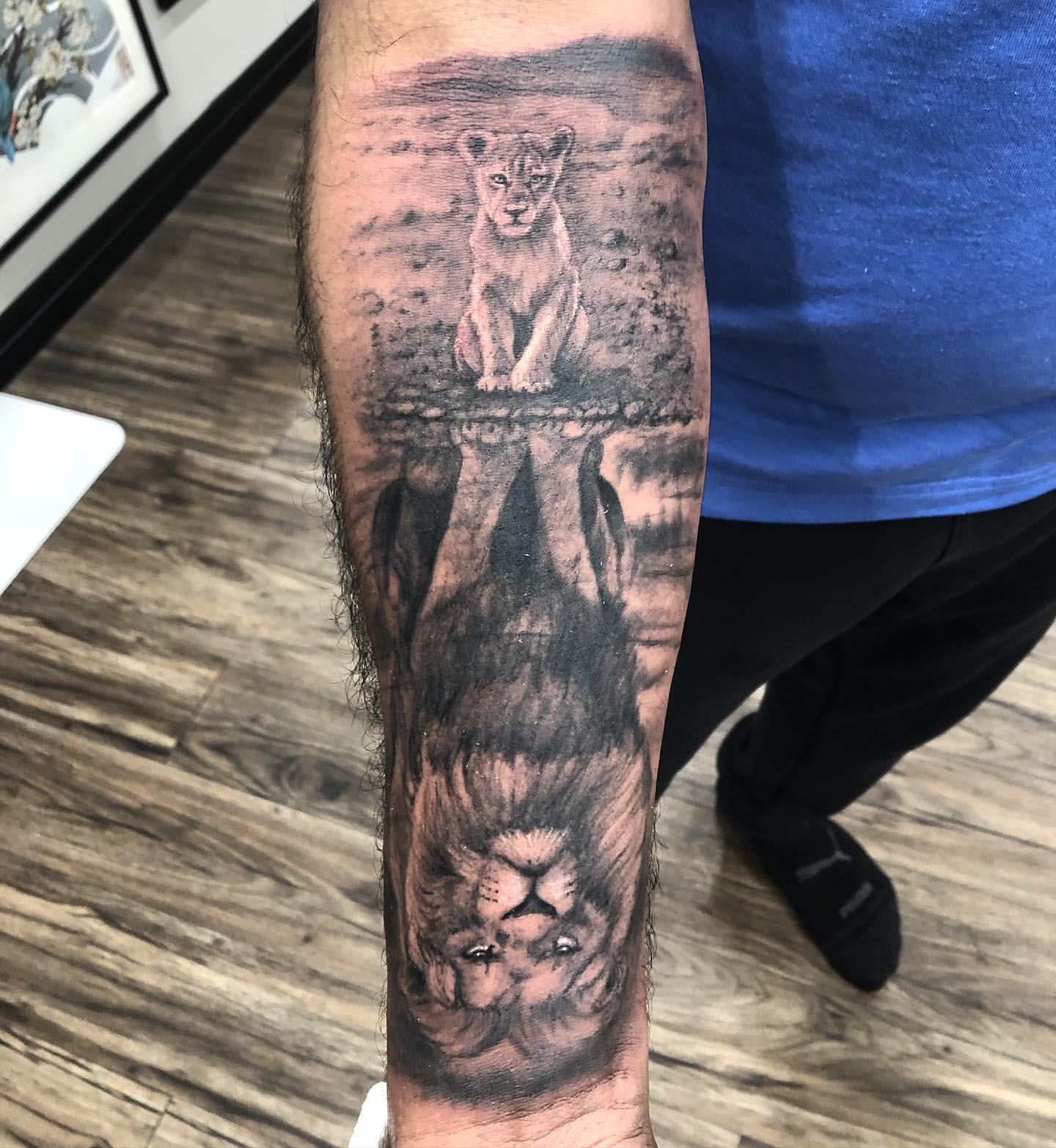 Lion and Cub Reflection Tattoo by Steve Hayes at Black Gold Tattoo Co in Edmonton Alberta Canada
