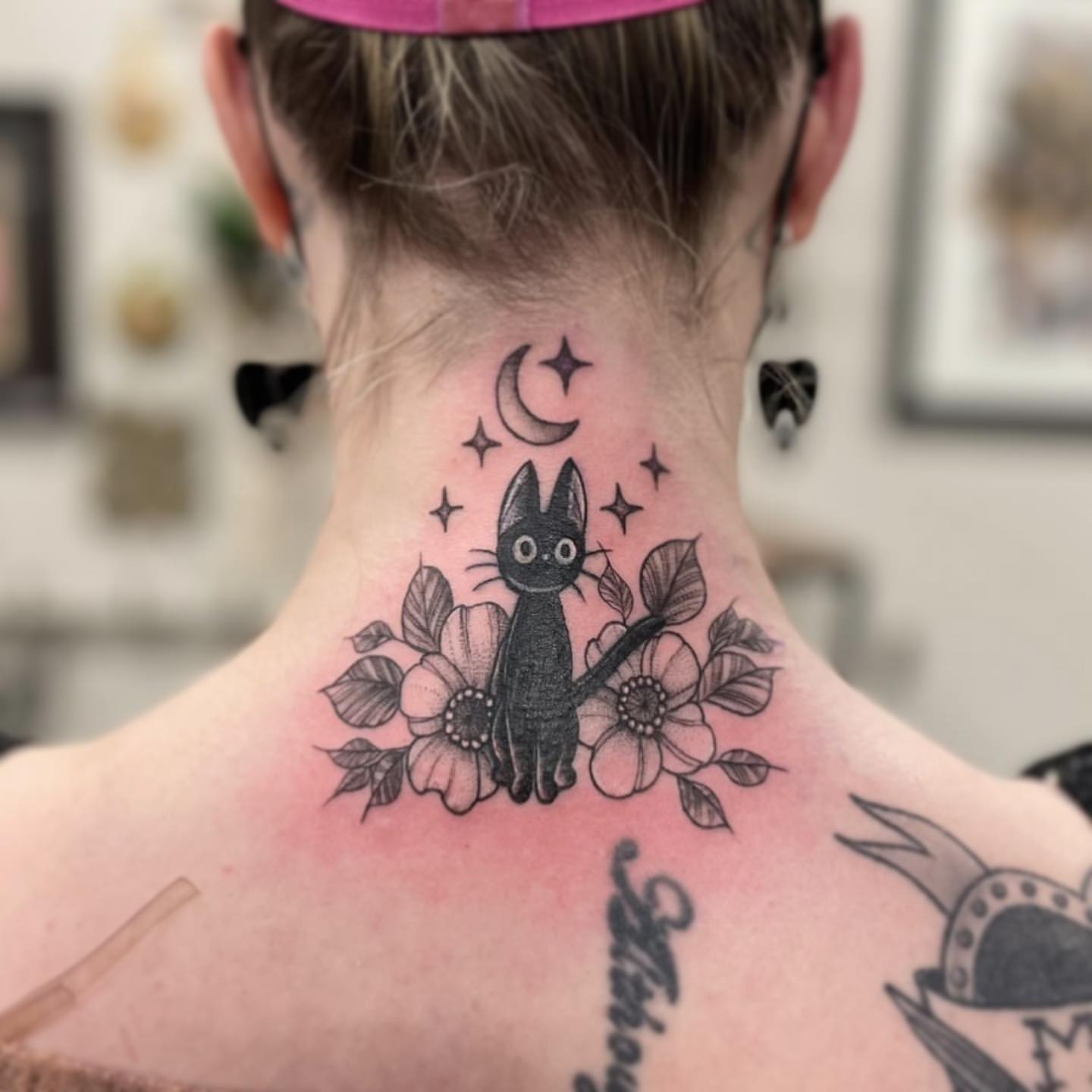 Jiji and Floral Tattoo by Vanessa Spezowka at Crimson Empire Tattoo in Edmonton Alberta Canada