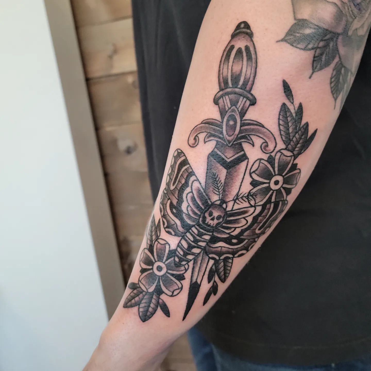 Dagger and Moth Tattoo by Sheila Anderson at Crimson Empire Tattoo in Edmonton Alberta Canada