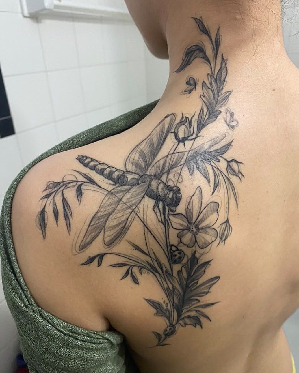 Dragonfly and Floral Tattoo by Adrienne Alexander at Silver Ghost Tattoo in Edmonton Alberta Canada
