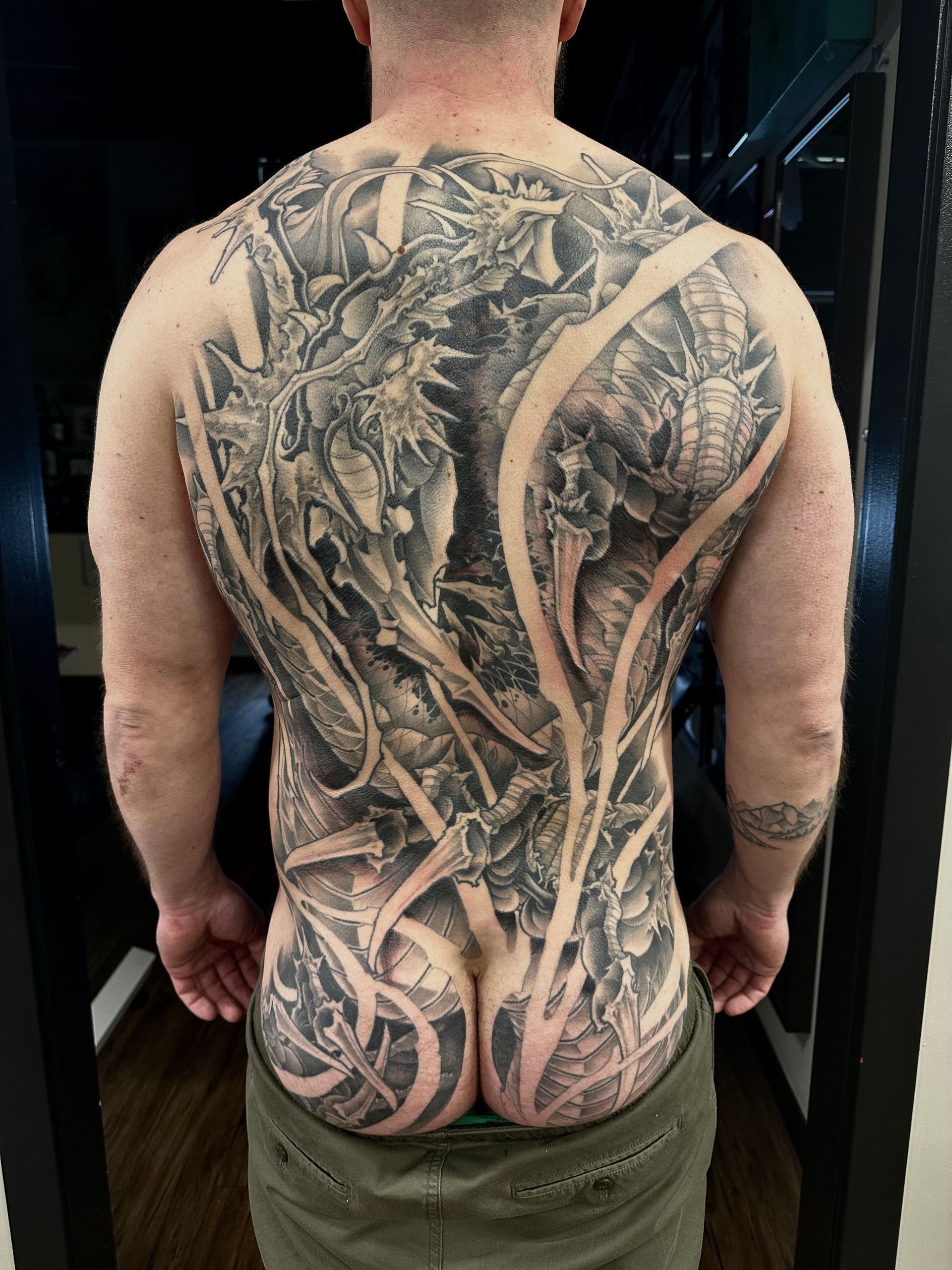 Dragon Backpiece by Brain Dangerfield at Black Gold Tattoo Co in Edmonton Alberta Canada