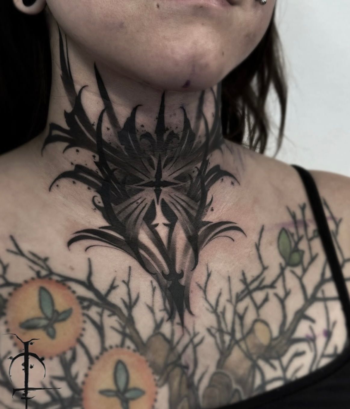 Ornamental Throat Tattoo by Val at Silver Ghost Tattoo in Edmonton Alberta Canada