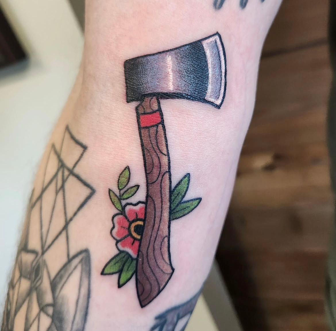 Axe Tattoo by Sheila Anderson at Crimson Empire Tattoo in Edmonton Alberta Canada