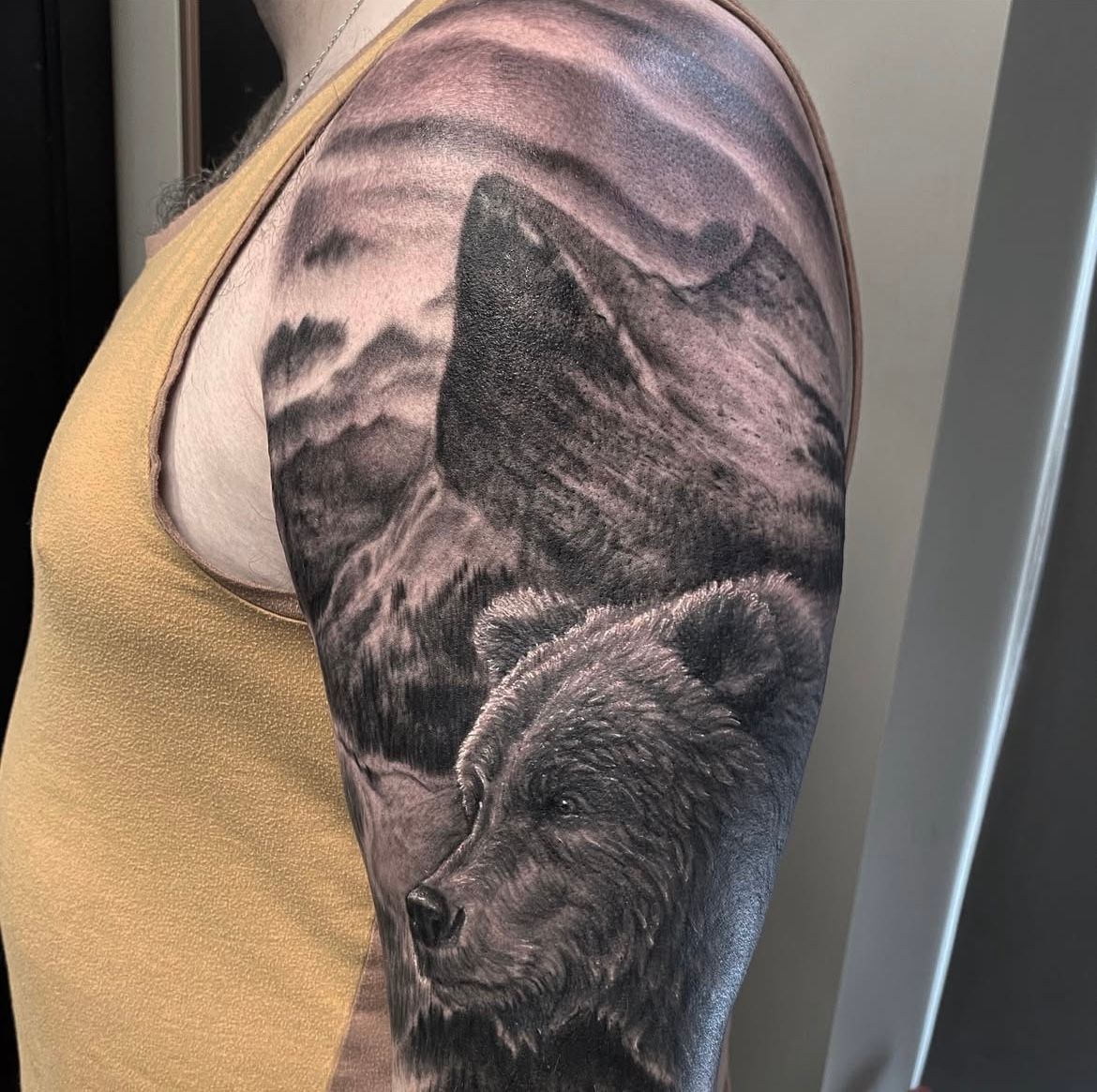 Bear and Mountains Tattoo by Steve Hayes at Black Gold Tattoo Co in Edmonton Alberta Canada