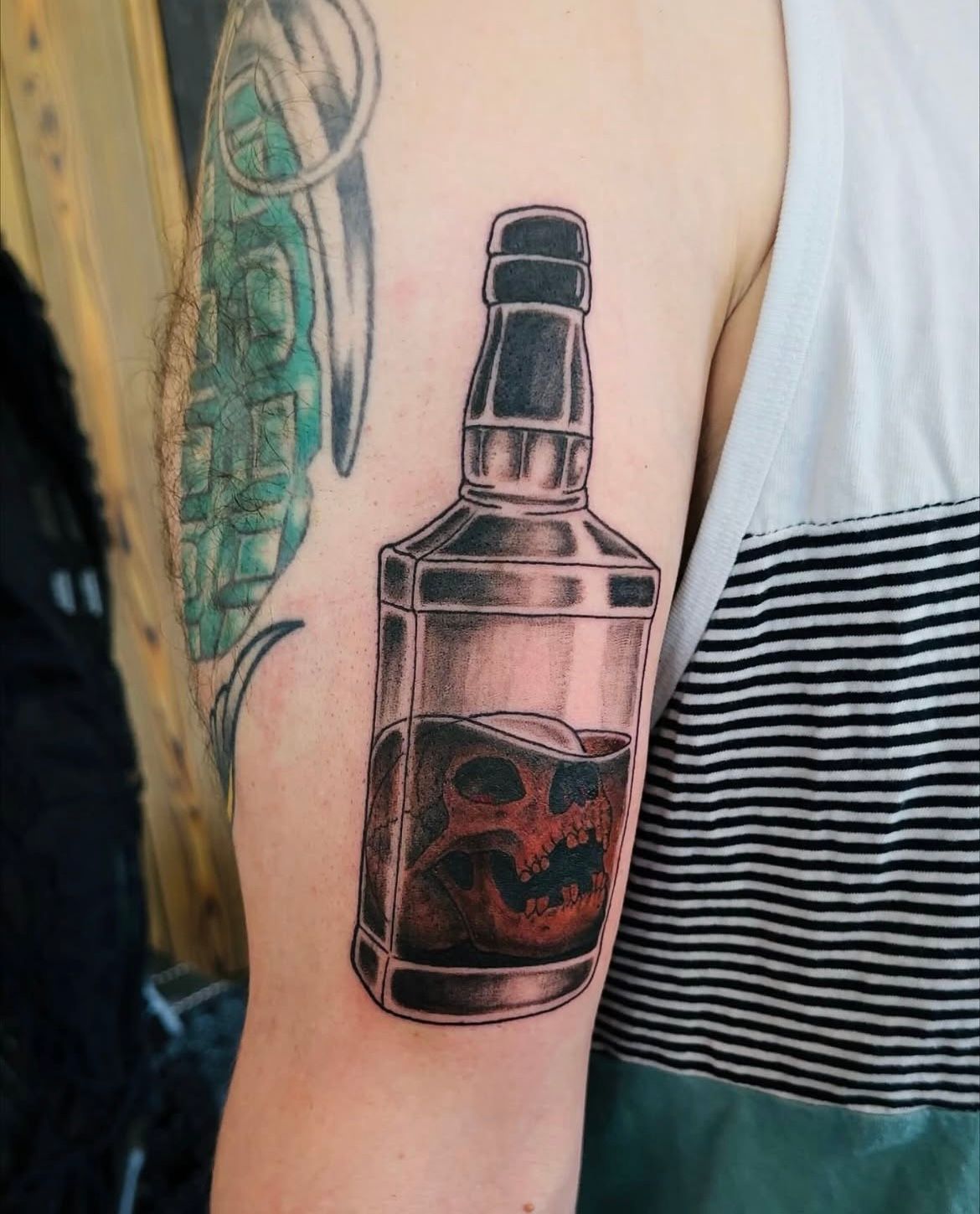 Skull in Whiskey Bottle Tattoo by Vinny Nguyen at Crimson Empire Tattoo in Edmonton Alberta Canada