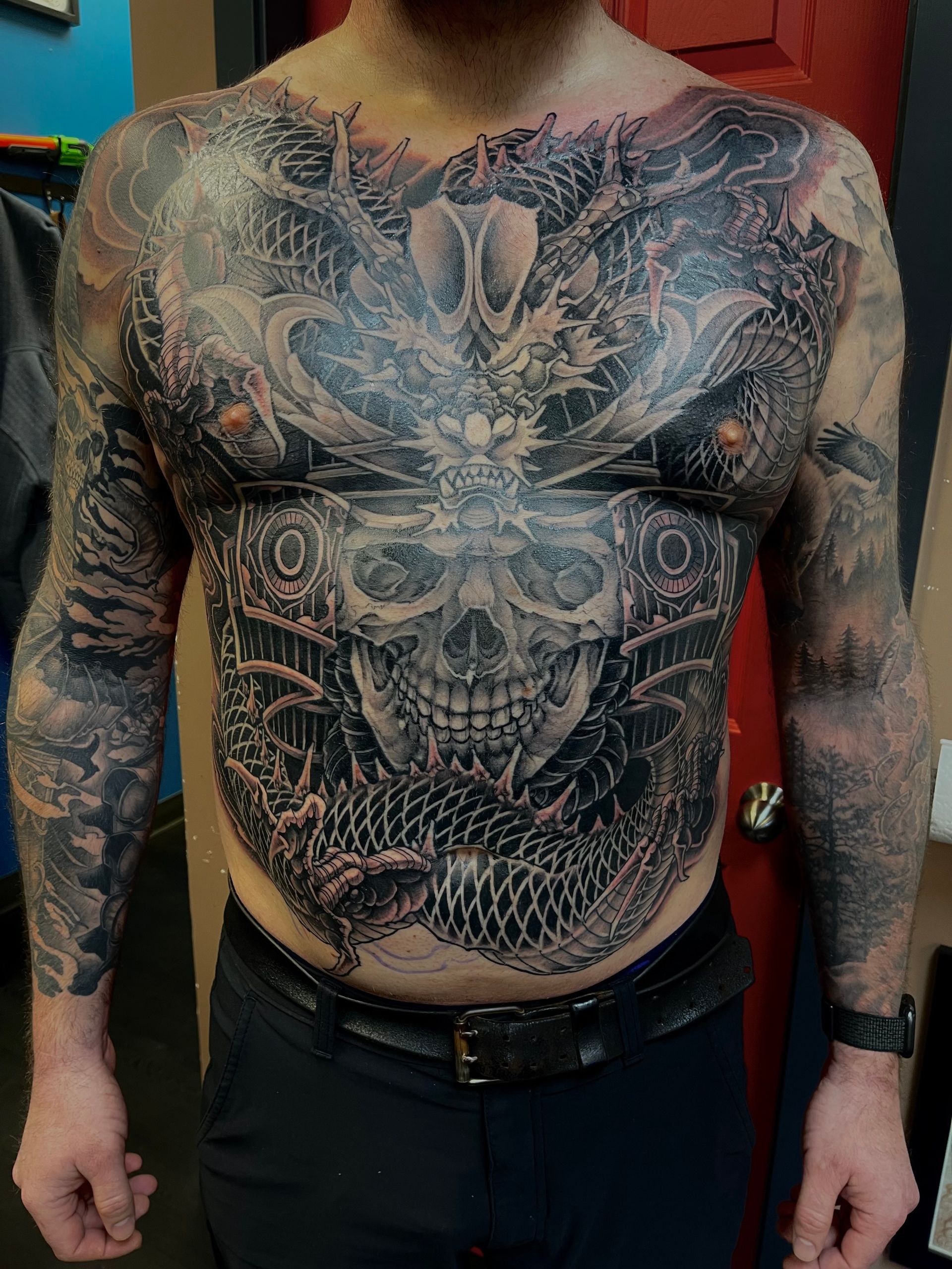 Skull and Dragon Full Torso Tattoo by Brain Dangerfield at Black Gold Tattoo Co in Edmonton Alberta Canada