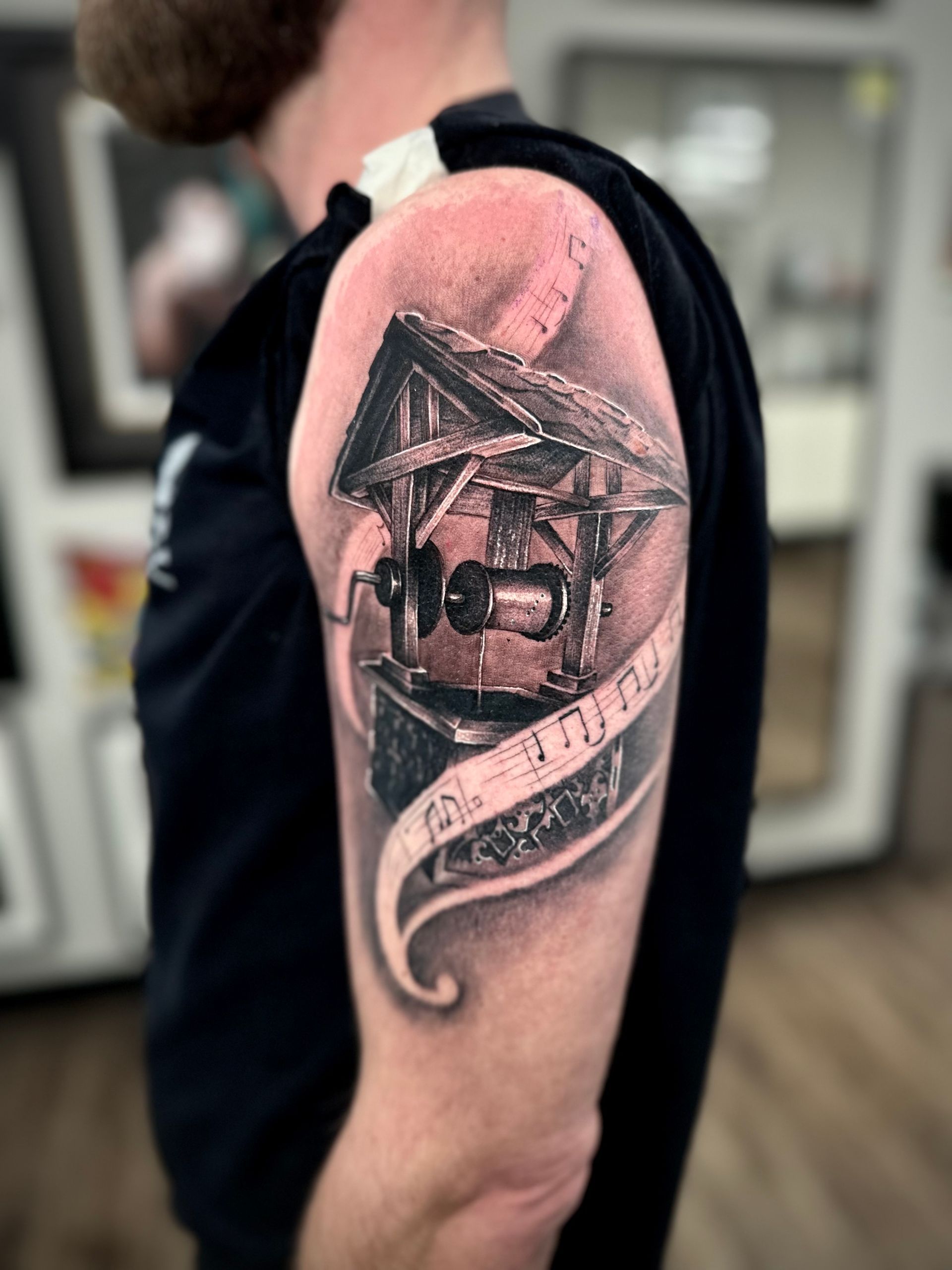Wishing Well Music Box Tattoo by Jackson Sukhov at Black Gold Tattoo Co in Edmonton Alberta Canada
