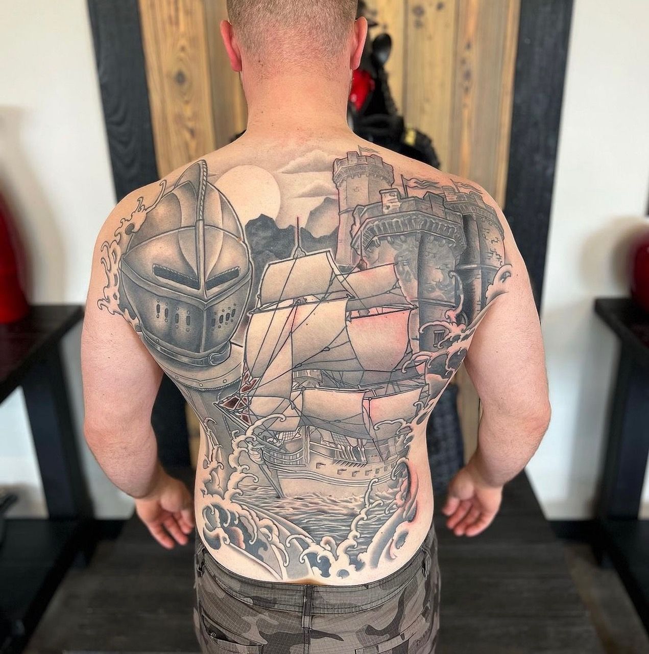 Ship, Castle and Knight Backpiece by Curt Semeniuk at Crimson Empire Tattoo in Edmonton Alberta Canada