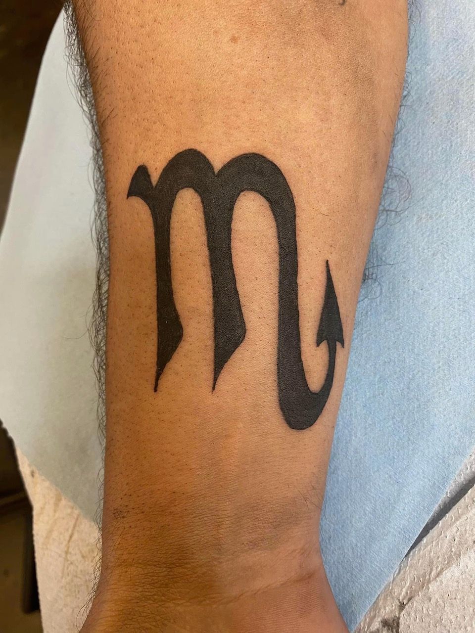 Scorpio Symbol Tattoo by Keon Courtney at Crimson Empire Tattoo in Edmonton Alberta Canada