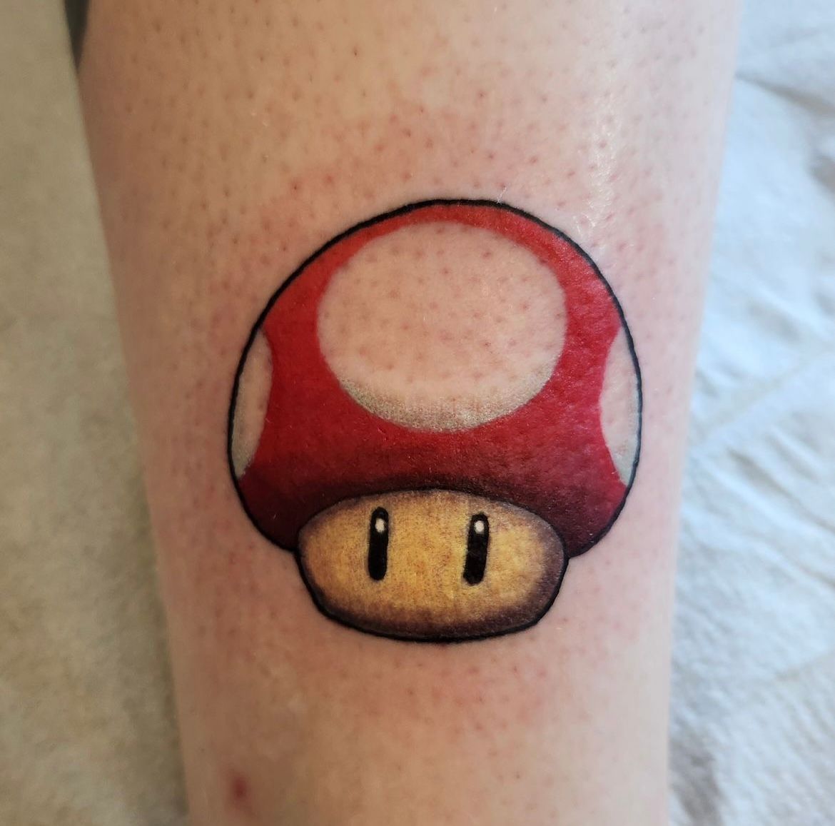 Mario Mushroom Tattoo by Sheila Anderson at Crimson Empire Tattoo in Edmonton Alberta Canada