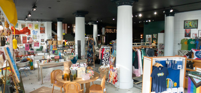 A large store filled with lots of furniture and clothes.
