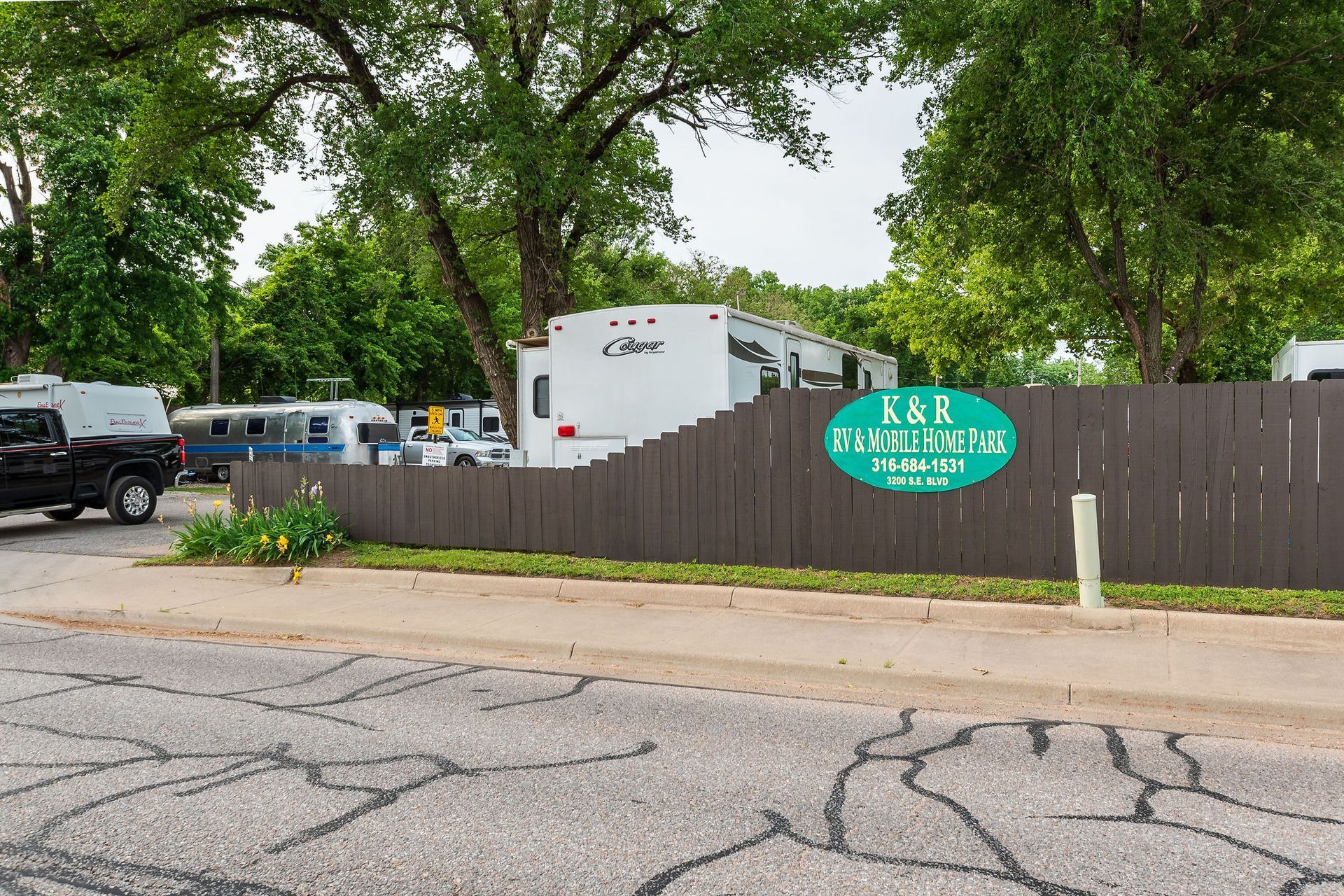 A fence with a sign that says r & r on it