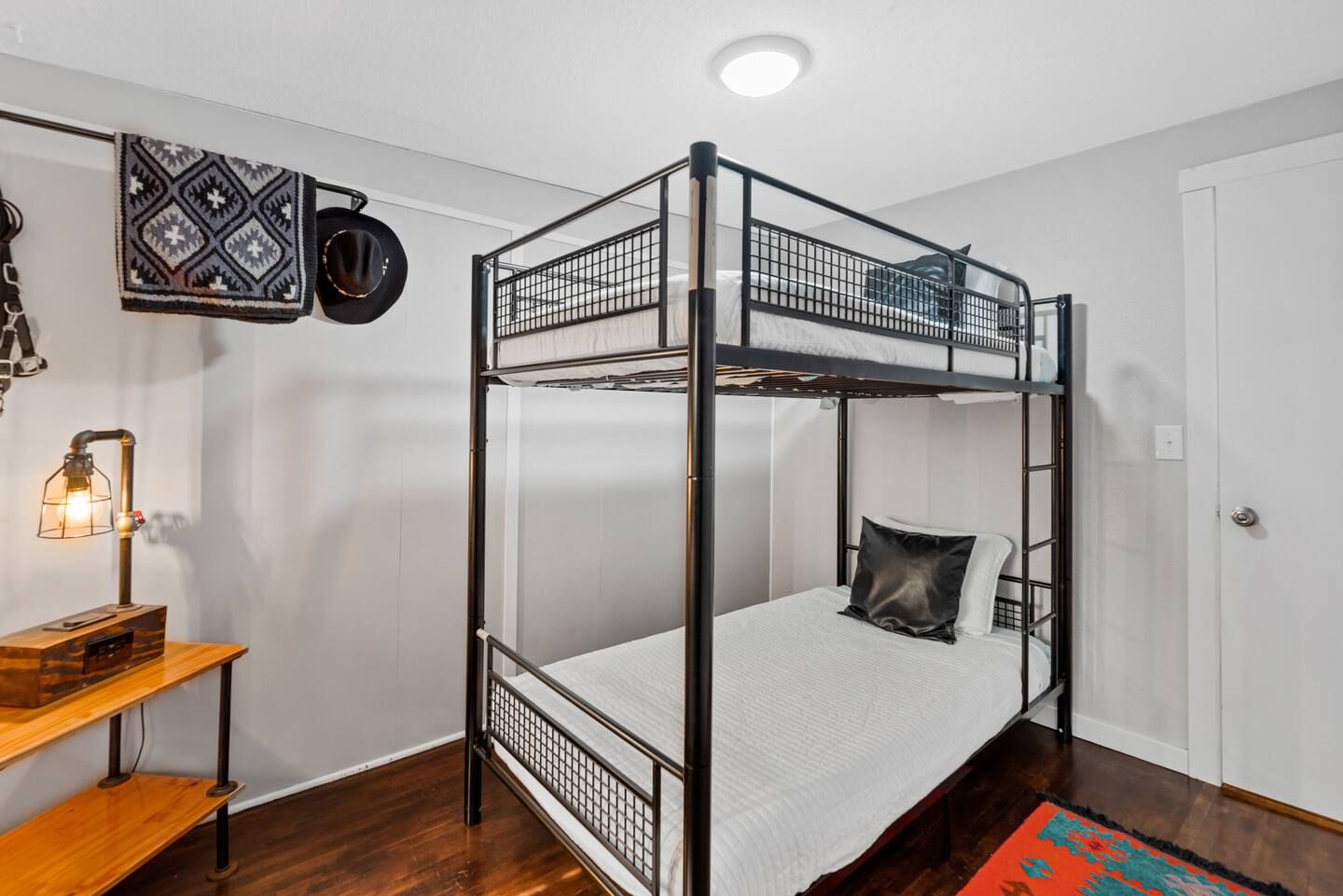 There is a bunk bed in the middle of the room.