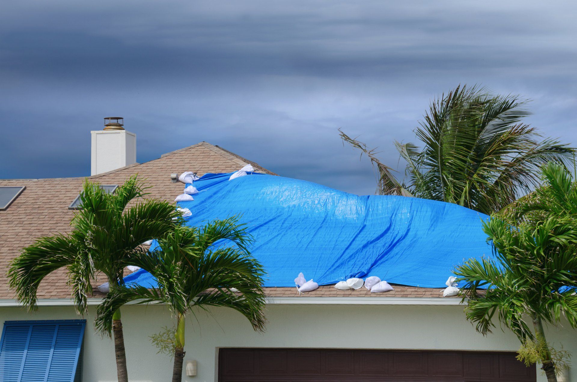Roof of home damaged by a hurricane