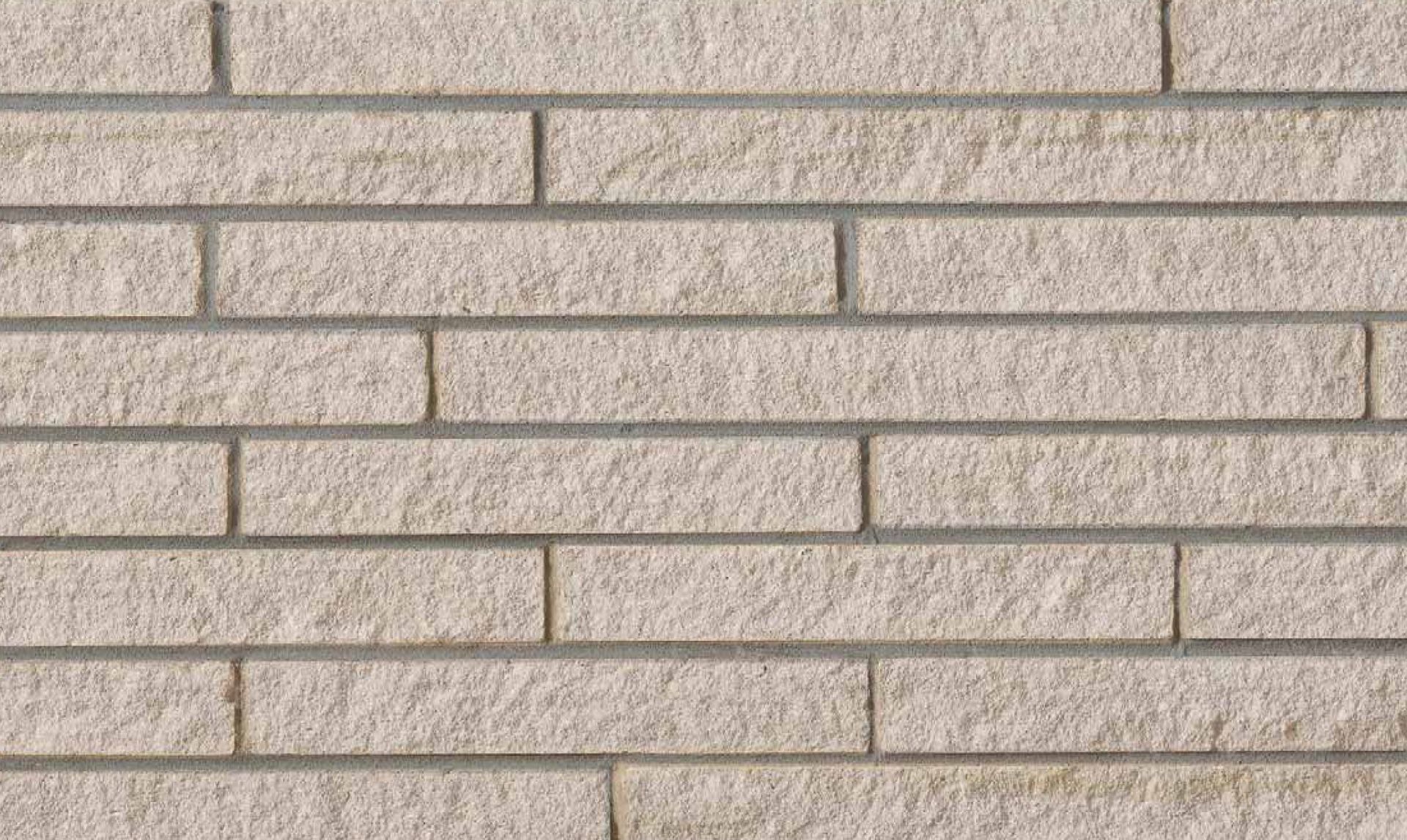 A close up of a white brick wall.