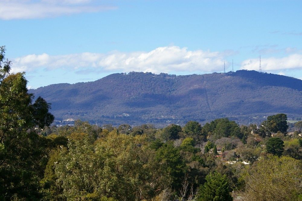 A View Of A Mountain Range With Trees In The Foreground — Kingaroy Crane Trucks & Equipment Hire In Cooyar, QLD