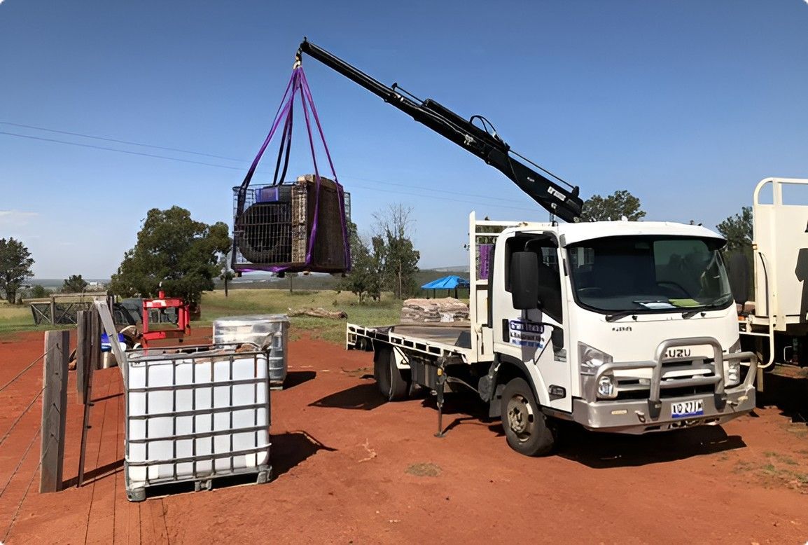 White Truck With A Crane Attached To The Back Of It — Kingaroy Crane Trucks & Equipment Hire In Kingaroy, QLD