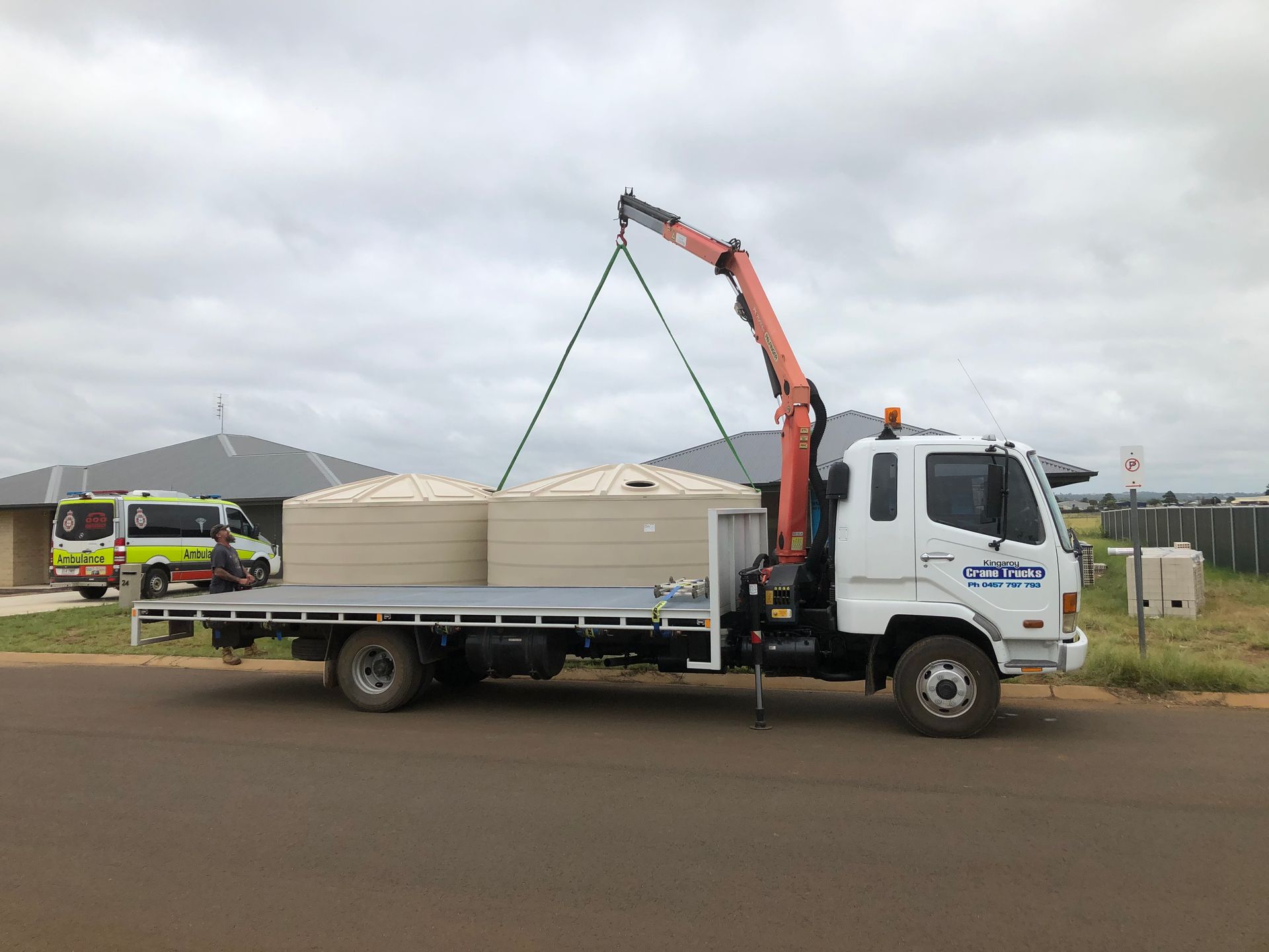 A Truck With A Crane On The Back Is Carrying Wood — Kingaroy Crane Trucks & Equipment Hire In Proston, QLD