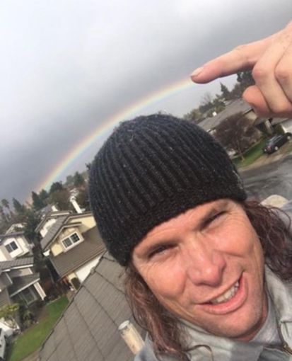 man pointing on the rainbow