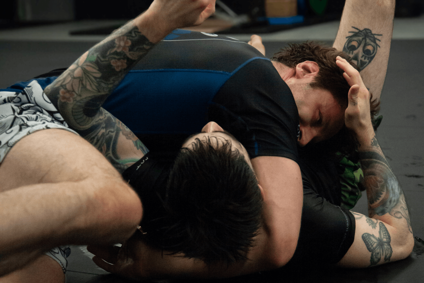 Adults drilling takedowns and ground control at Connecticut Submission Grappling in Bridgeport, CT for discipline.