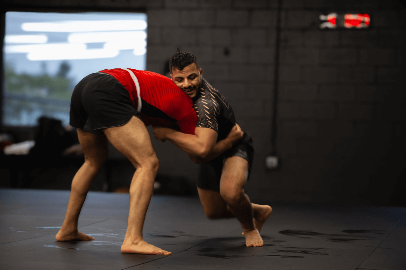 Adults training Grappling at Connecticut Submission Grappling in Bridgeport, CT, improving cardio and endurance together.