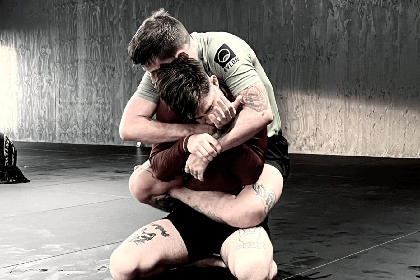 Partners practice no-gi grappling rounds at Connecticut Submission Grappling in Bridgeport, CT to build coordination.