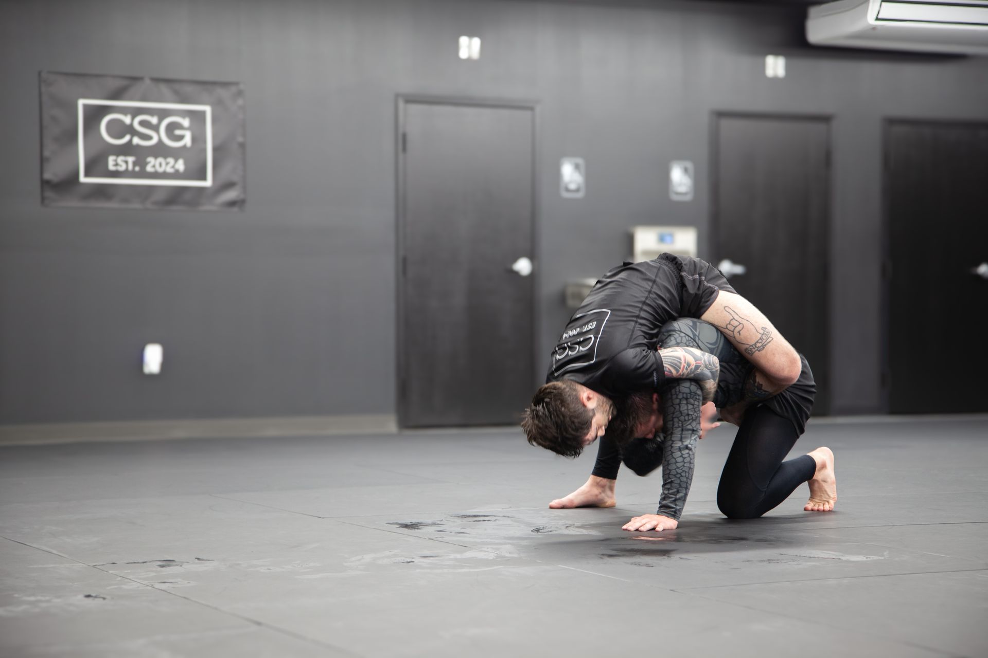 Adults train no-gi grappling at Connecticut Submission Grappling in Bridgeport, CT.