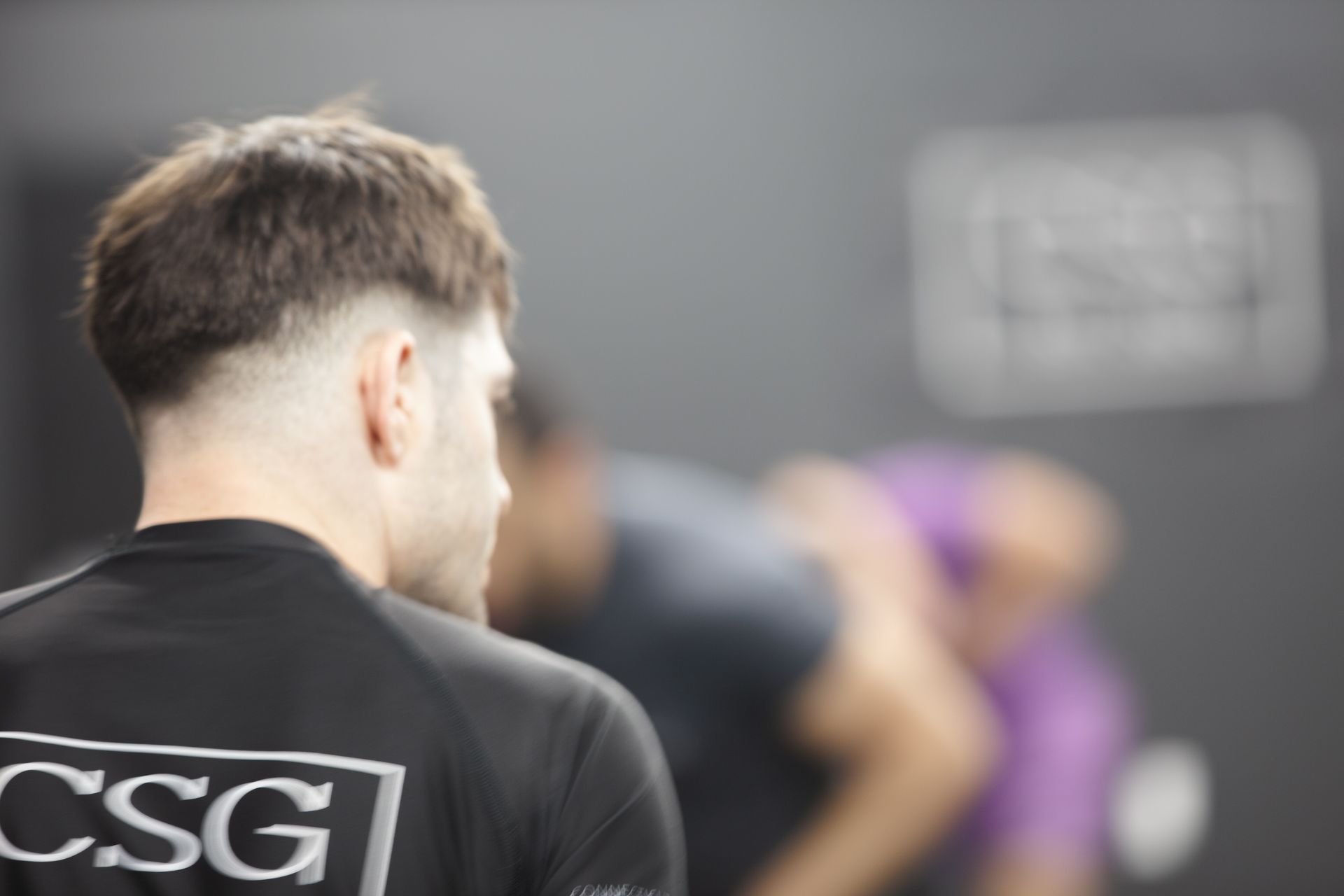 Adult students drilling fast hand-fighting reactions at Connecticut Submission Grappling in Bridgeport, CT for sharper timing.