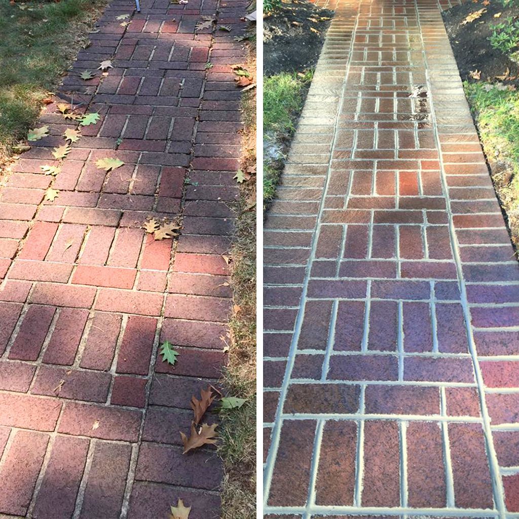 Before-and-after view of a red brick walkway being pressure washed to remove dirt and reveal clean mortar lines.