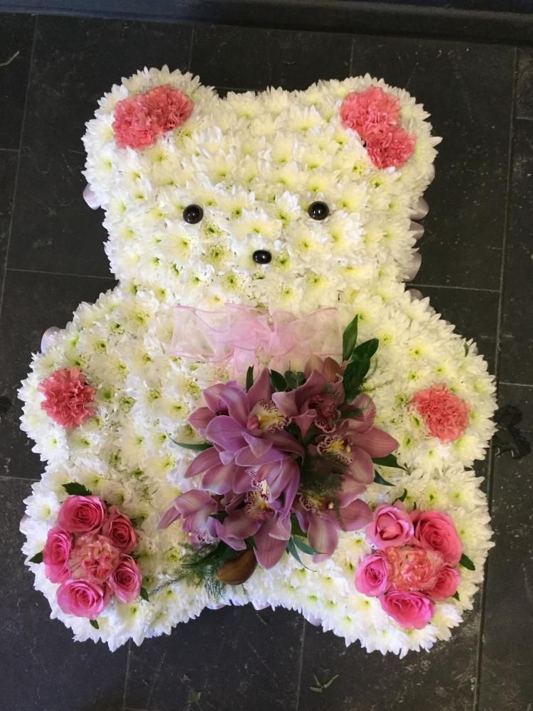 funeral flowers shaped as a teddy bear white and pink